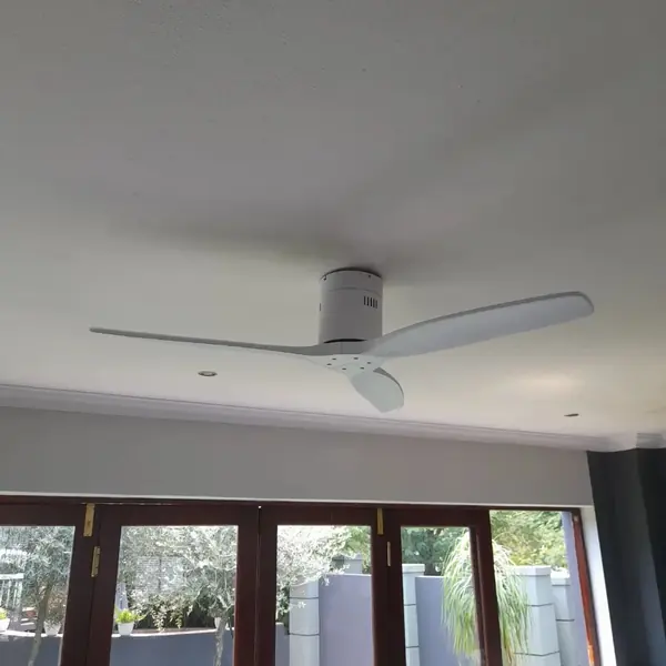 Handyman job: white ceiling fan installed, wooden folding doors below