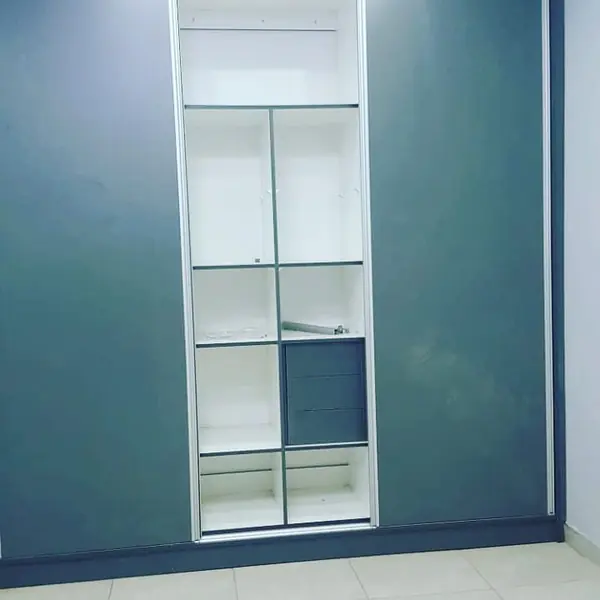 Renovations job: wardrobe middle door open showing shelves and drawers