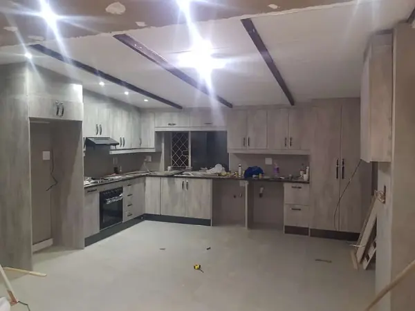 Renovations job: new kitchen units fitted, ceiling beams, night lighting glare