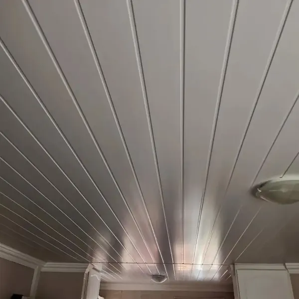 Renovations job: white panelled ceiling, grey-lit