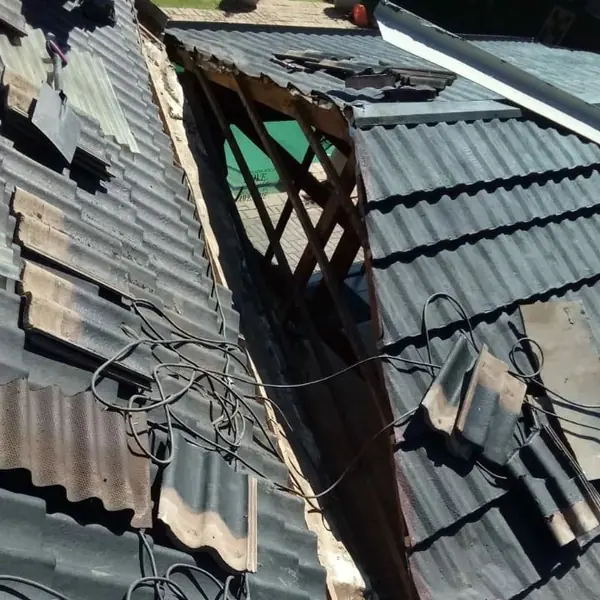 Before. Renovations job: tile roof opened up, tiles stripped, timbers and cables exposed